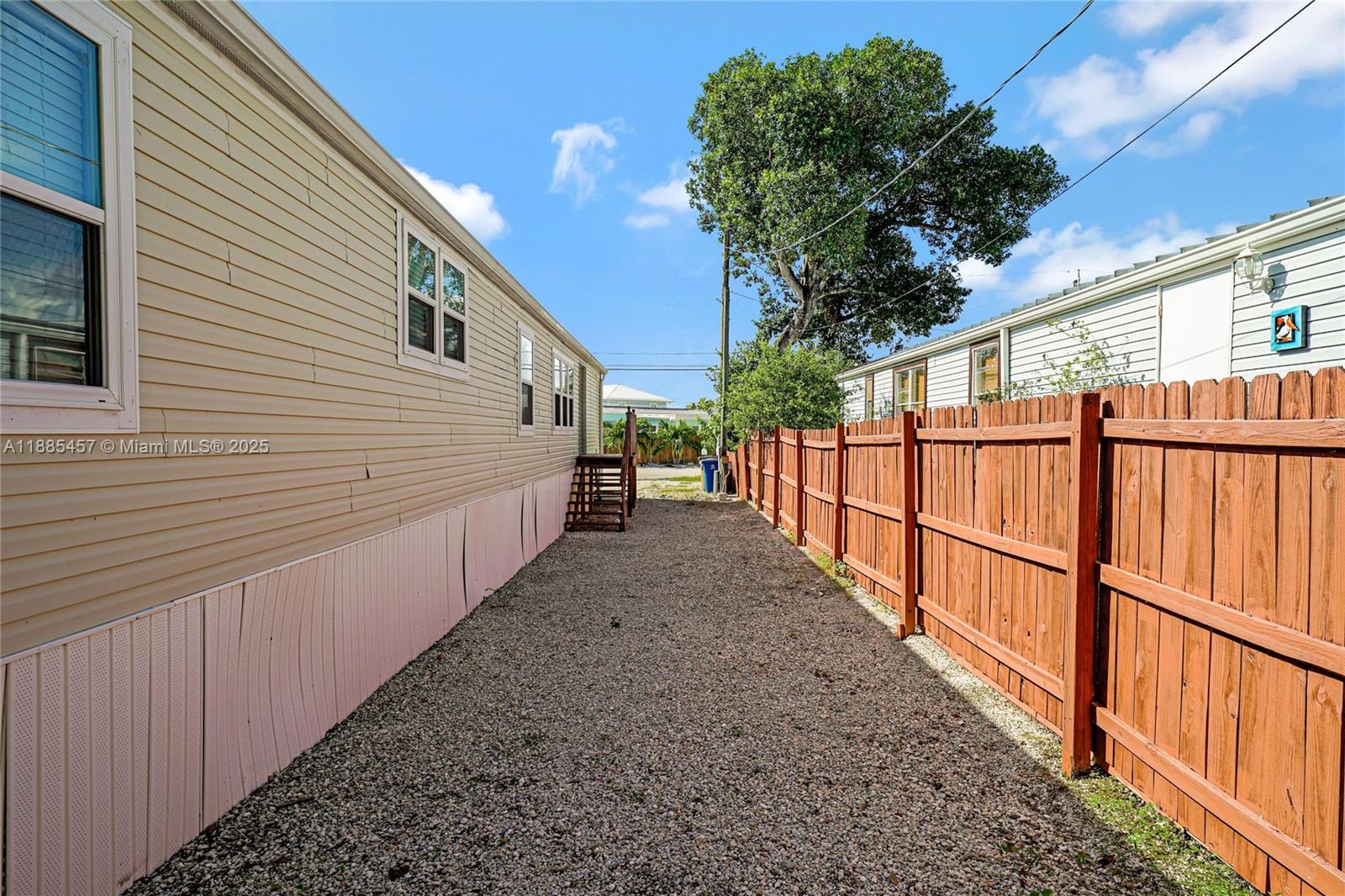 945 Plantation Road, Unit 945 Key Largo, FL 33037 - Photo 41 of 66 a view of a house with wooden fence
