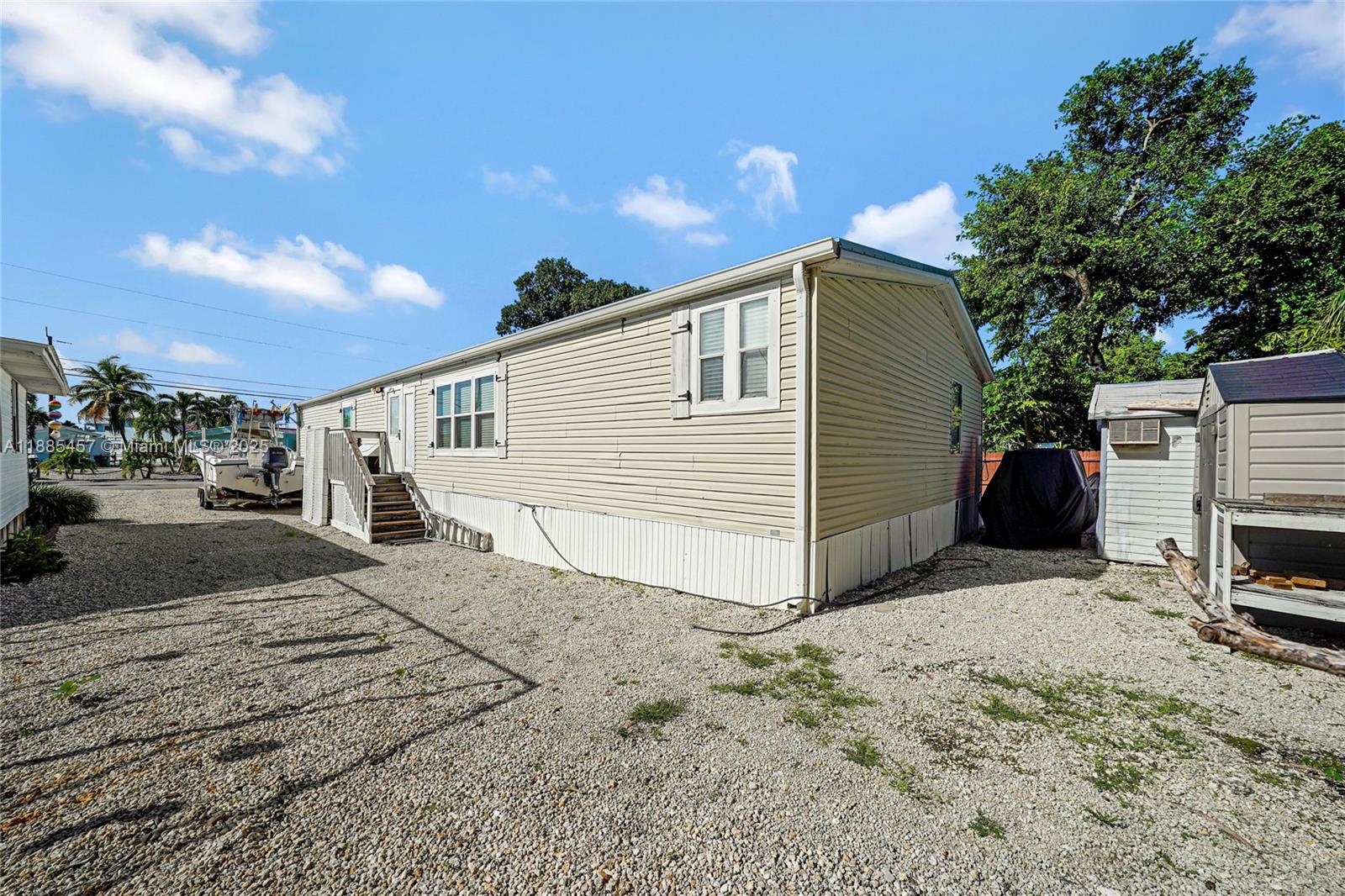 945 Plantation Road, Unit 945 Key Largo, FL 33037 - Photo 42 of 66 a view of a house with a patio