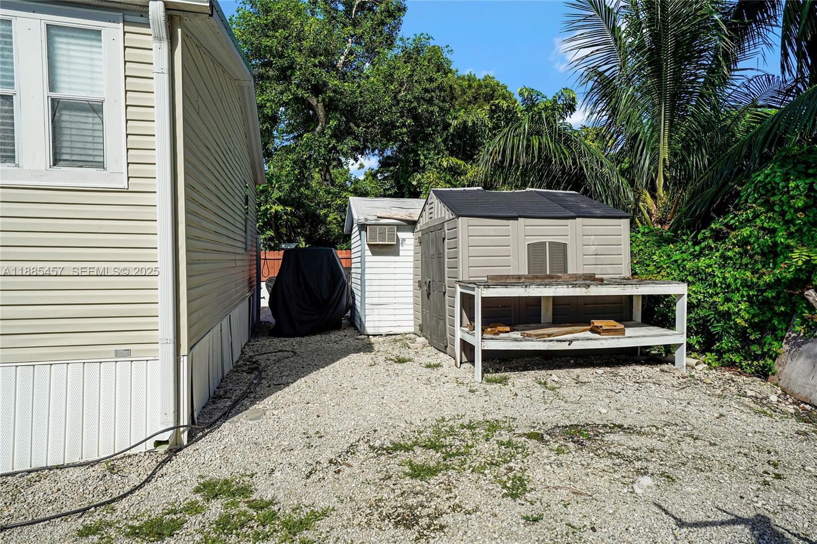 945 Plantation Road, Unit 945 Key Largo, FL 33037 - Photo 43 of 66 a view of a terrace with a trees