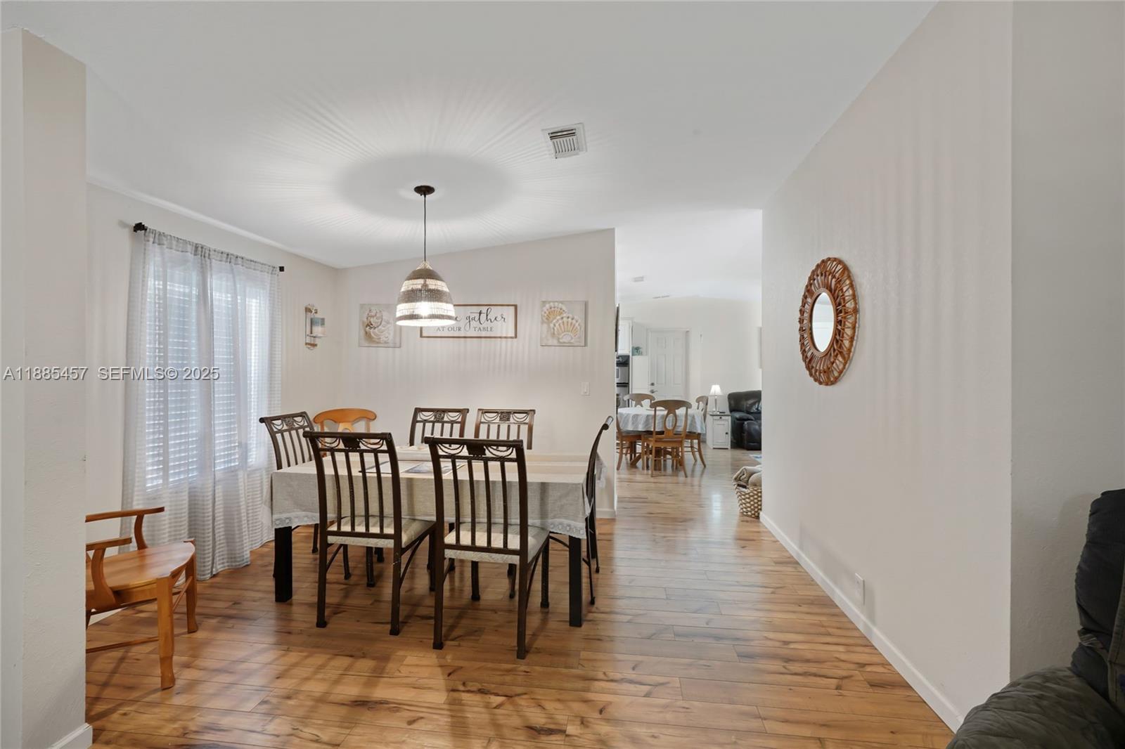 945 Plantation Road, Unit 945 Key Largo, FL 33037 - Photo 6 of 66 a view of a dining room with furniture window and wooden floor