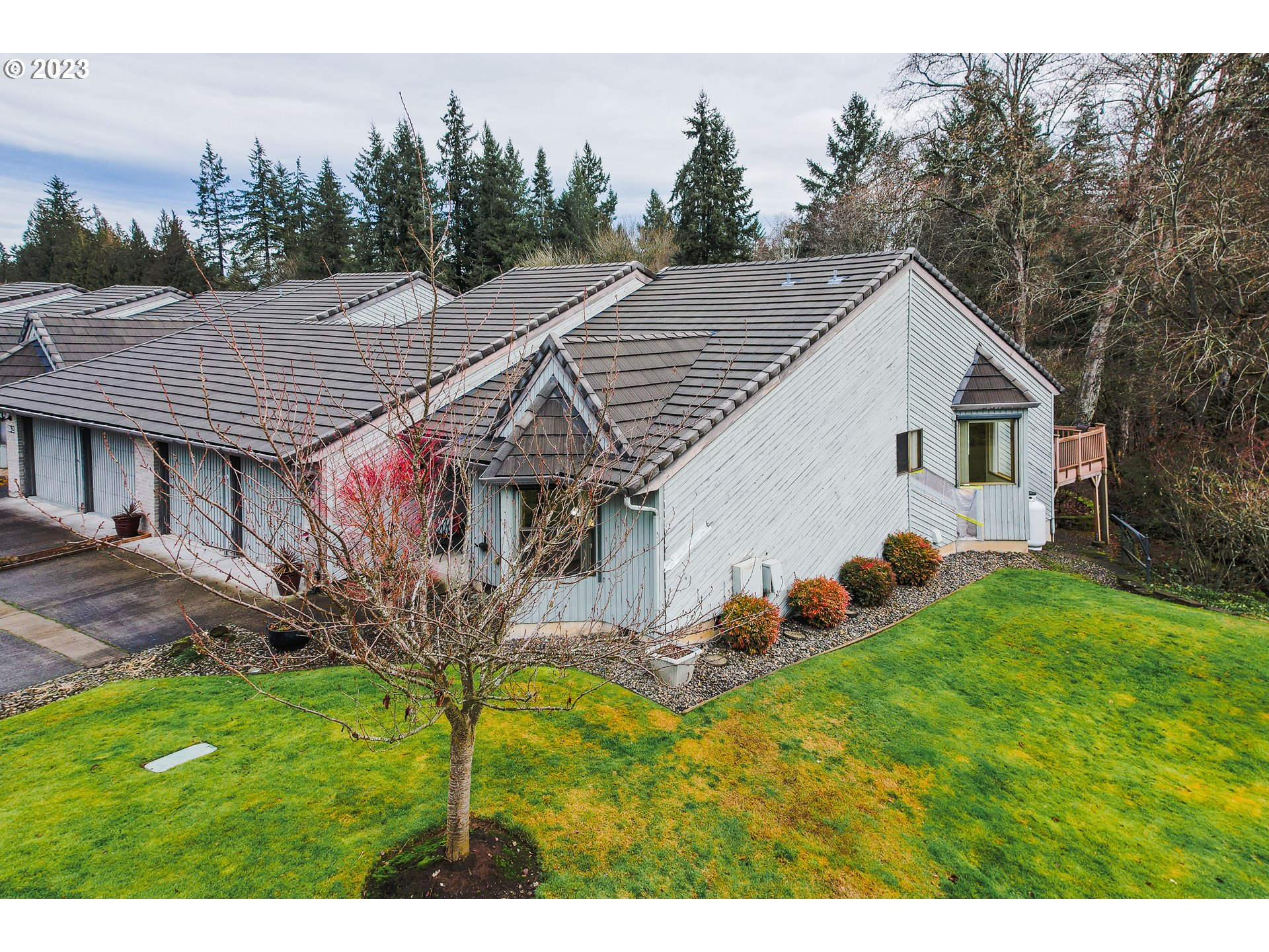 3300 Northeast 164th Street, Unit D1 Ridgefield, WA 98642 - Photo 1 of 27 a backyard of a house with table and chairs
