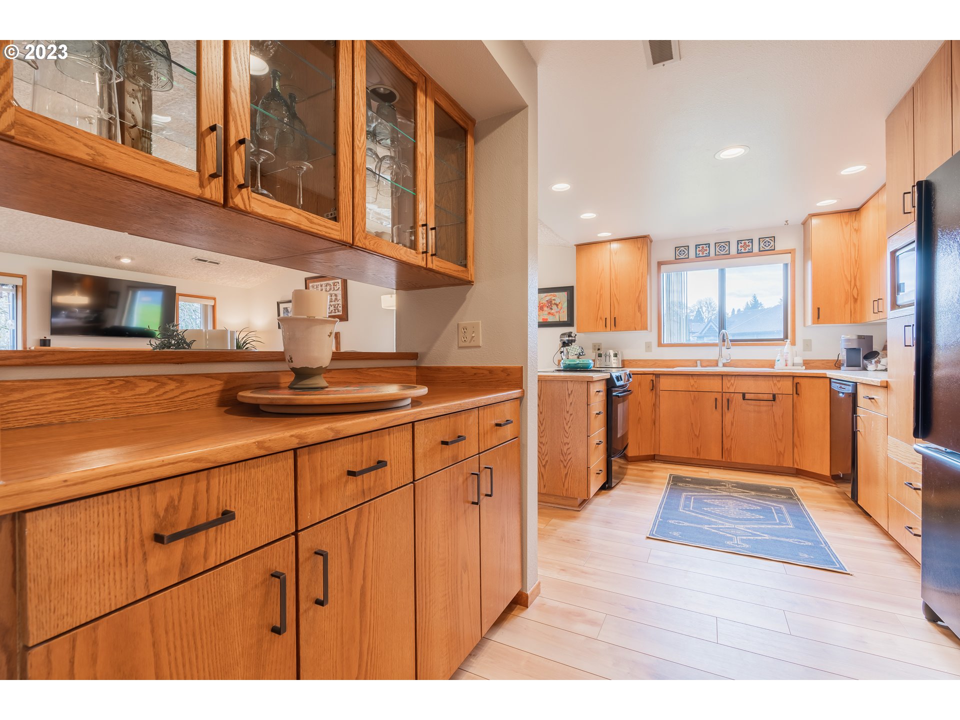3300 Northeast 164th Street, Unit D1 Ridgefield, WA 98642 - Photo 11 of 27 a kitchen with stainless steel appliances granite countertop a sink and cabinets