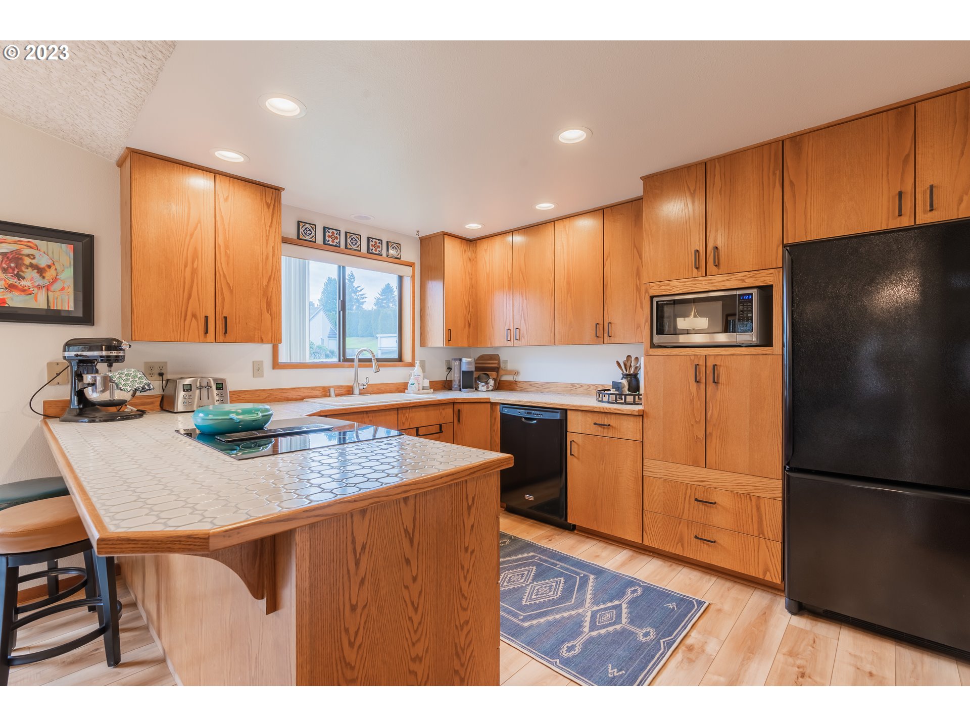 3300 Northeast 164th Street, Unit D1 Ridgefield, WA 98642 - Photo 14 of 27 a kitchen with refrigerator cabinets and a counter top space
