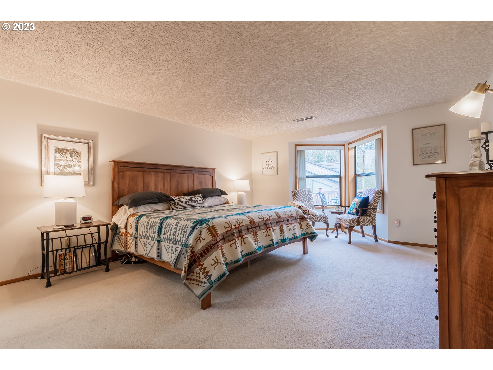 3300 Northeast 164th Street, Unit D1 Ridgefield, WA 98642 - Photo 15 of 27 a bedroom with a bed and a table