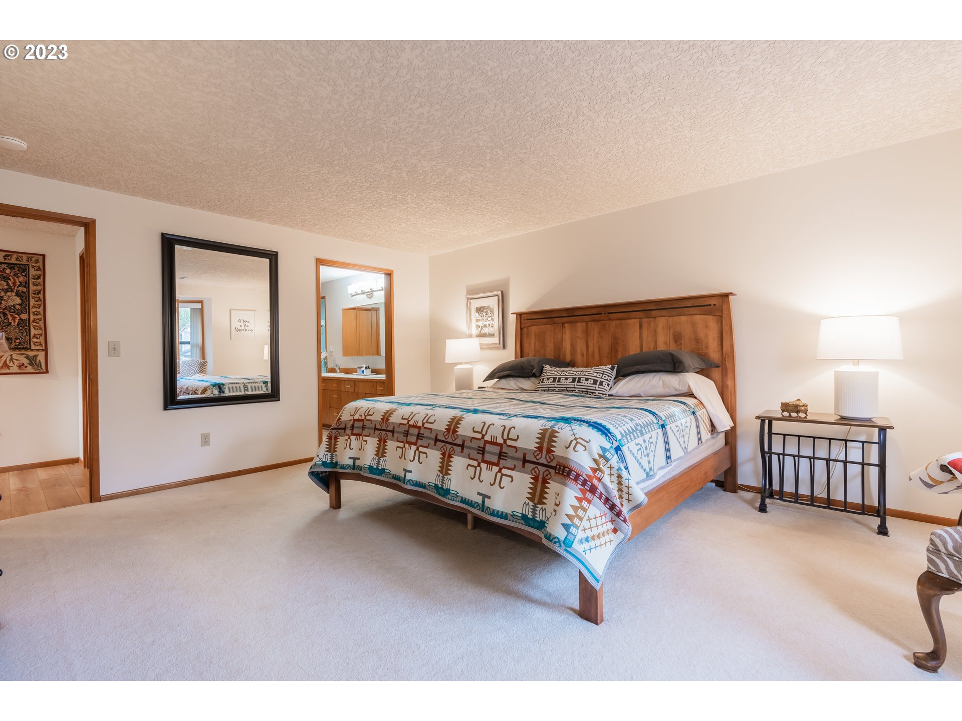 3300 Northeast 164th Street, Unit D1 Ridgefield, WA 98642 - Photo 16 of 27 a bedroom with a bed a couch and dresser
