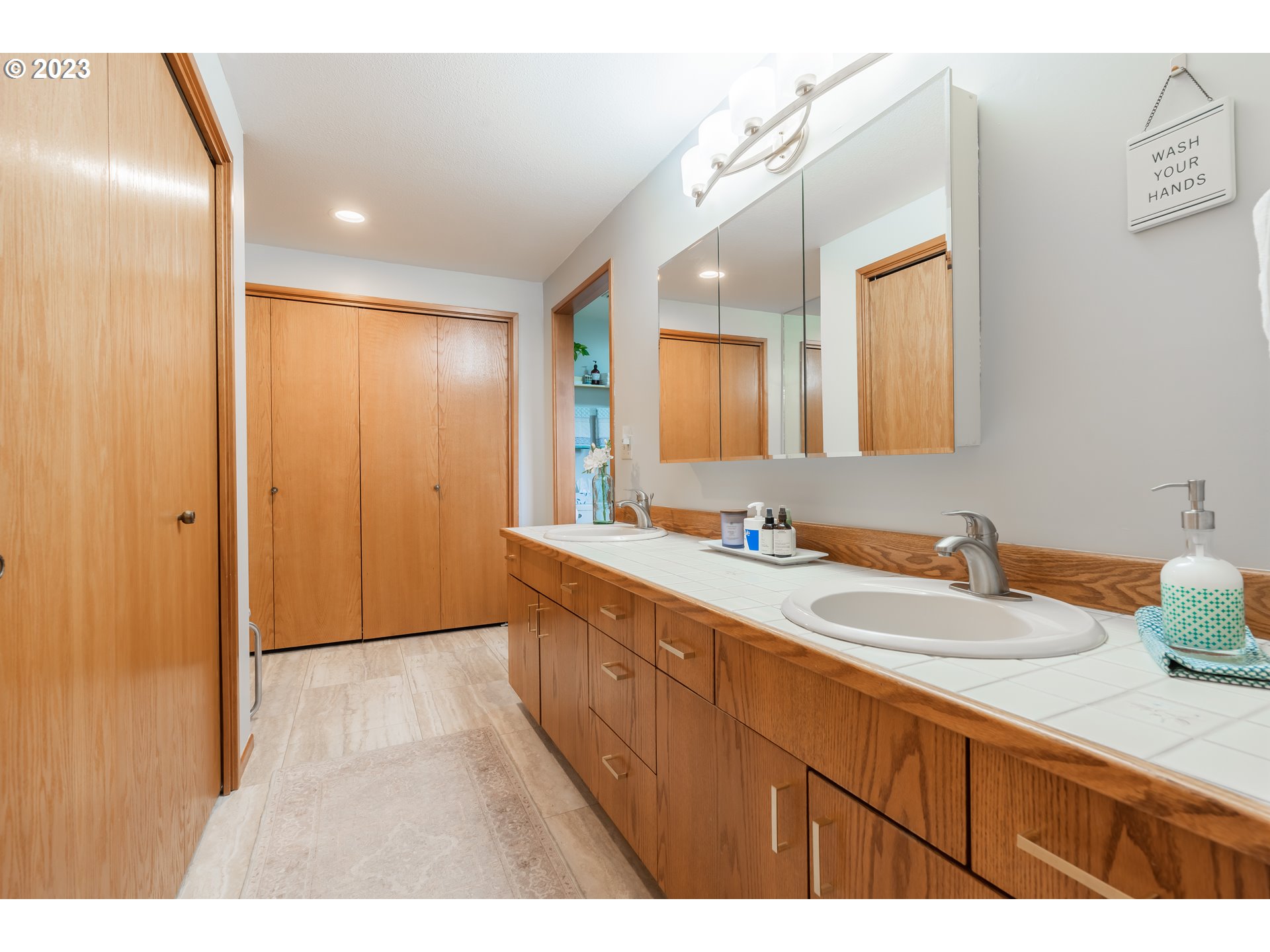 3300 Northeast 164th Street, Unit D1 Ridgefield, WA 98642 - Photo 17 of 27 a bathroom with a sink and a mirror