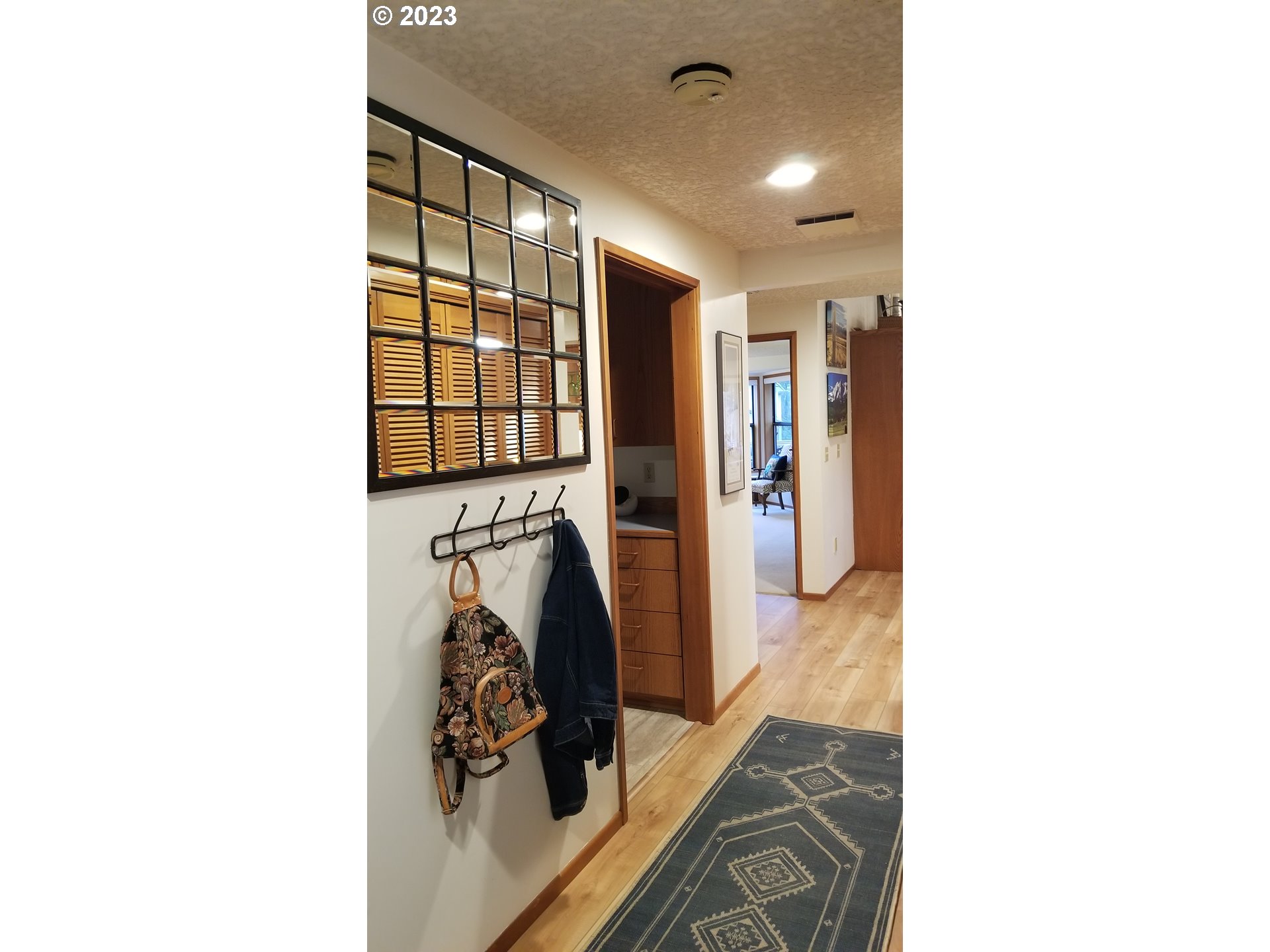 3300 Northeast 164th Street, Unit D1 Ridgefield, WA 98642 - Photo 5 of 27 a hallway with windows and couch