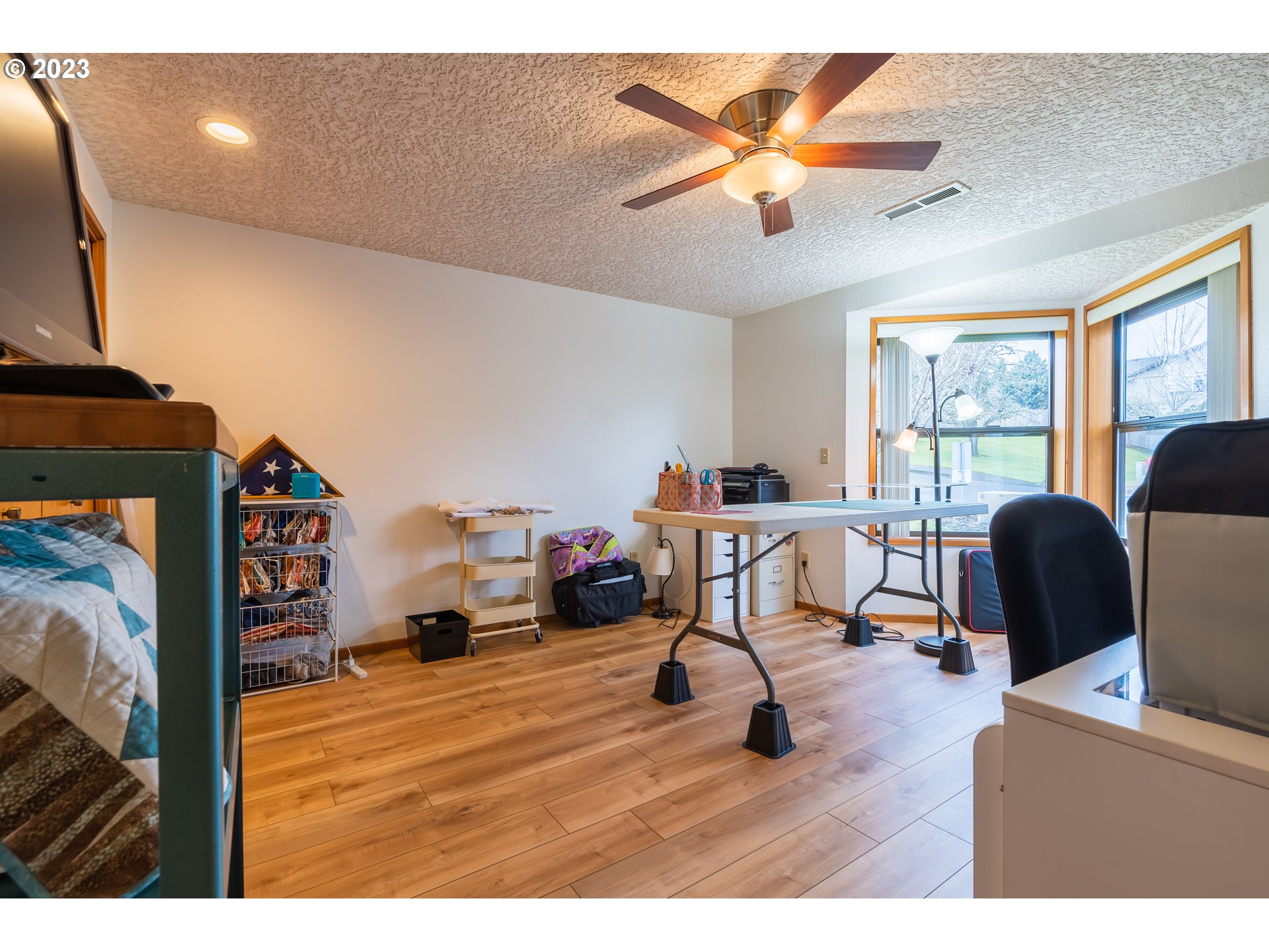 3300 Northeast 164th Street, Unit D1 Ridgefield, WA 98642 - Photo 6 of 27 a living room with furniture and a flat screen tv