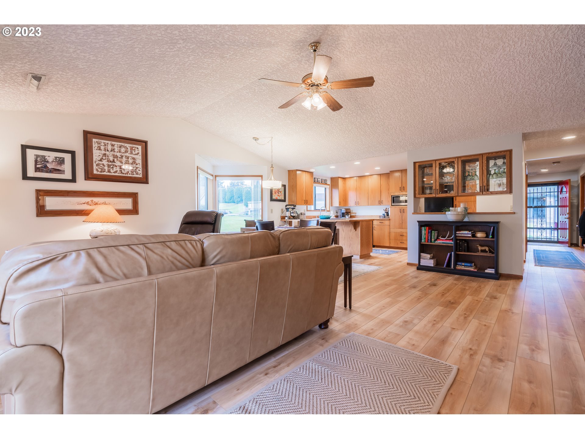 3300 Northeast 164th Street, Unit D1 Ridgefield, WA 98642 - Photo 7 of 27 a living room with furniture and kitchen view