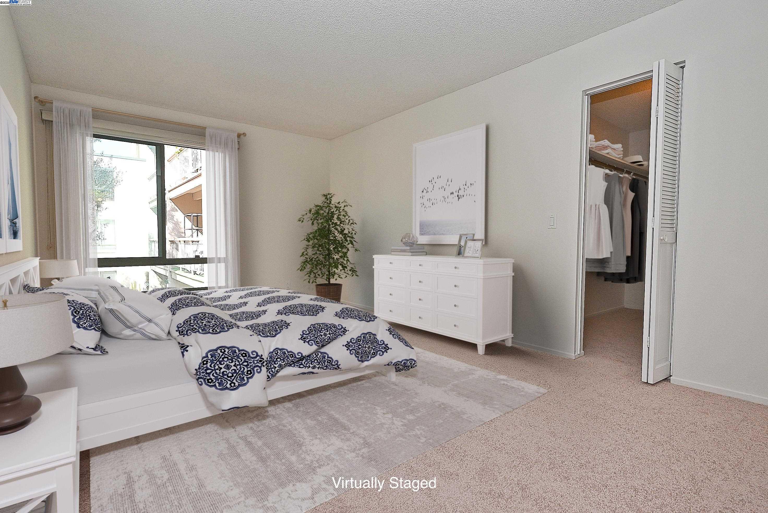 320 North Civic Drive, Unit 307 Walnut Creek, CA 94596 - Photo 1 of 37 a spacious bedroom with a bed and a window