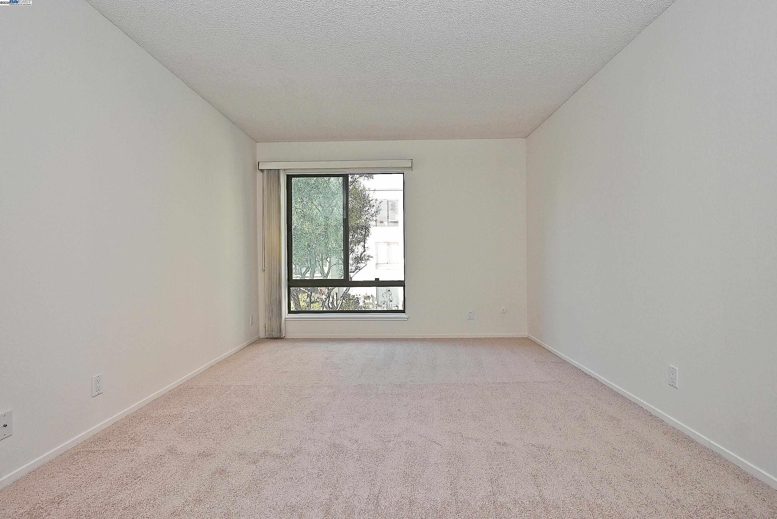 320 North Civic Drive, Unit 307 Walnut Creek, CA 94596 - Photo 16 of 37 an empty room with a window
