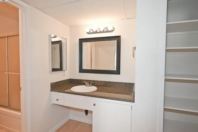 a bathroom with a sink and a mirror