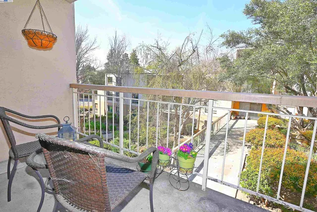 a view of balcony with furniture