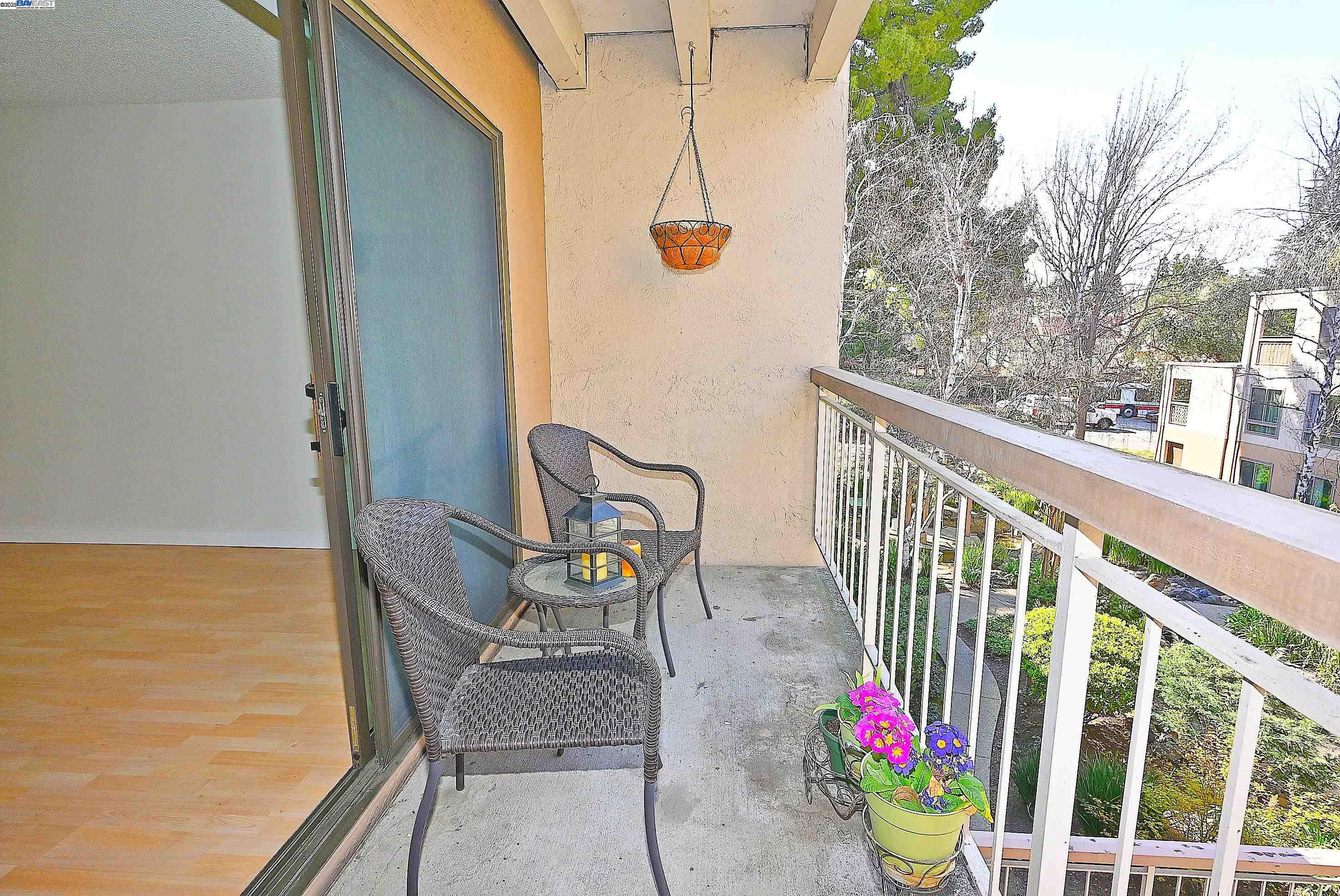 320 North Civic Drive, Unit 307 Walnut Creek, CA 94596 - Photo 24 of 37 a balcony with table and chairs