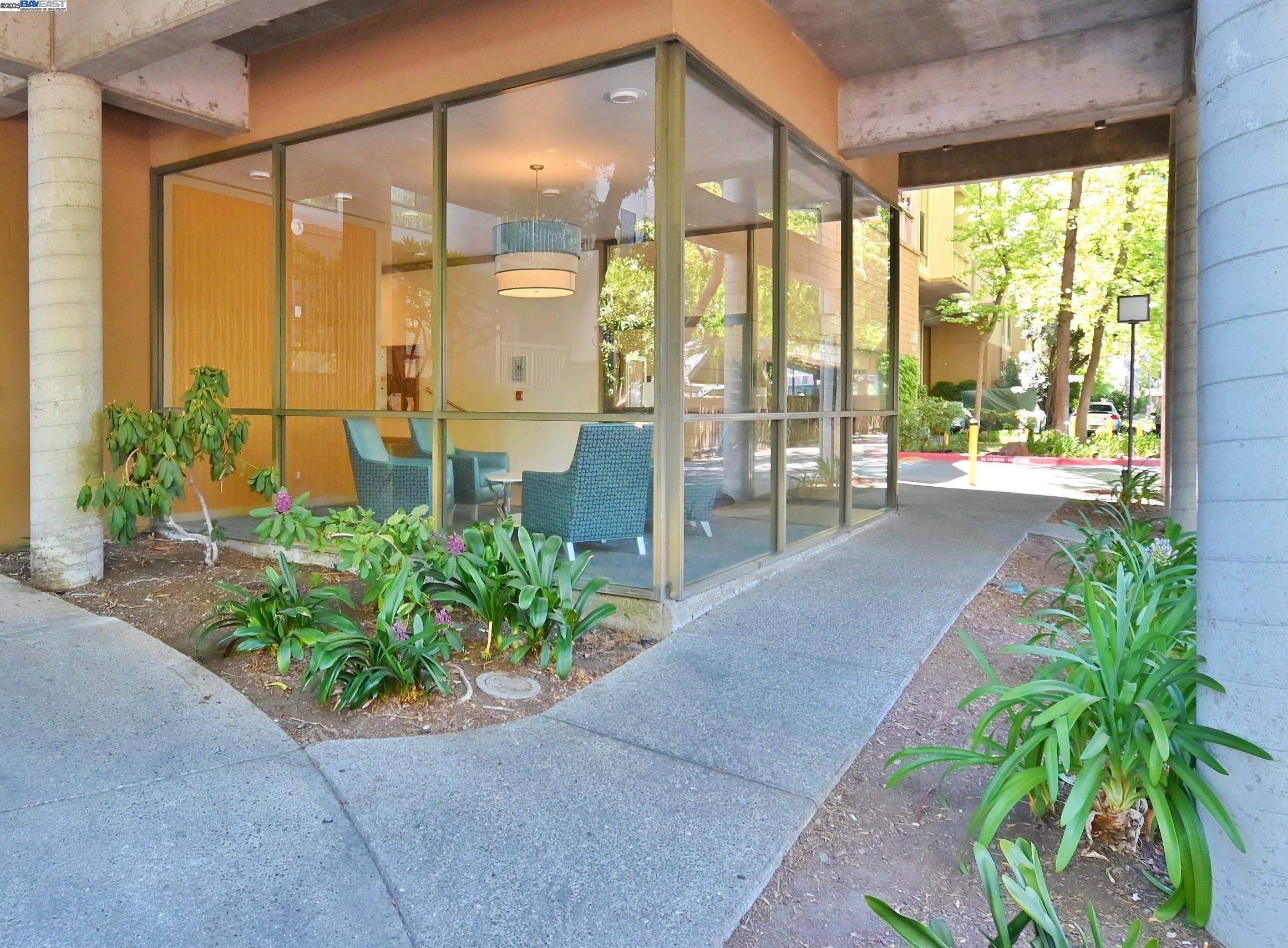 320 North Civic Drive, Unit 307 Walnut Creek, CA 94596 - Photo 26 of 37 a front view of a house with a garden