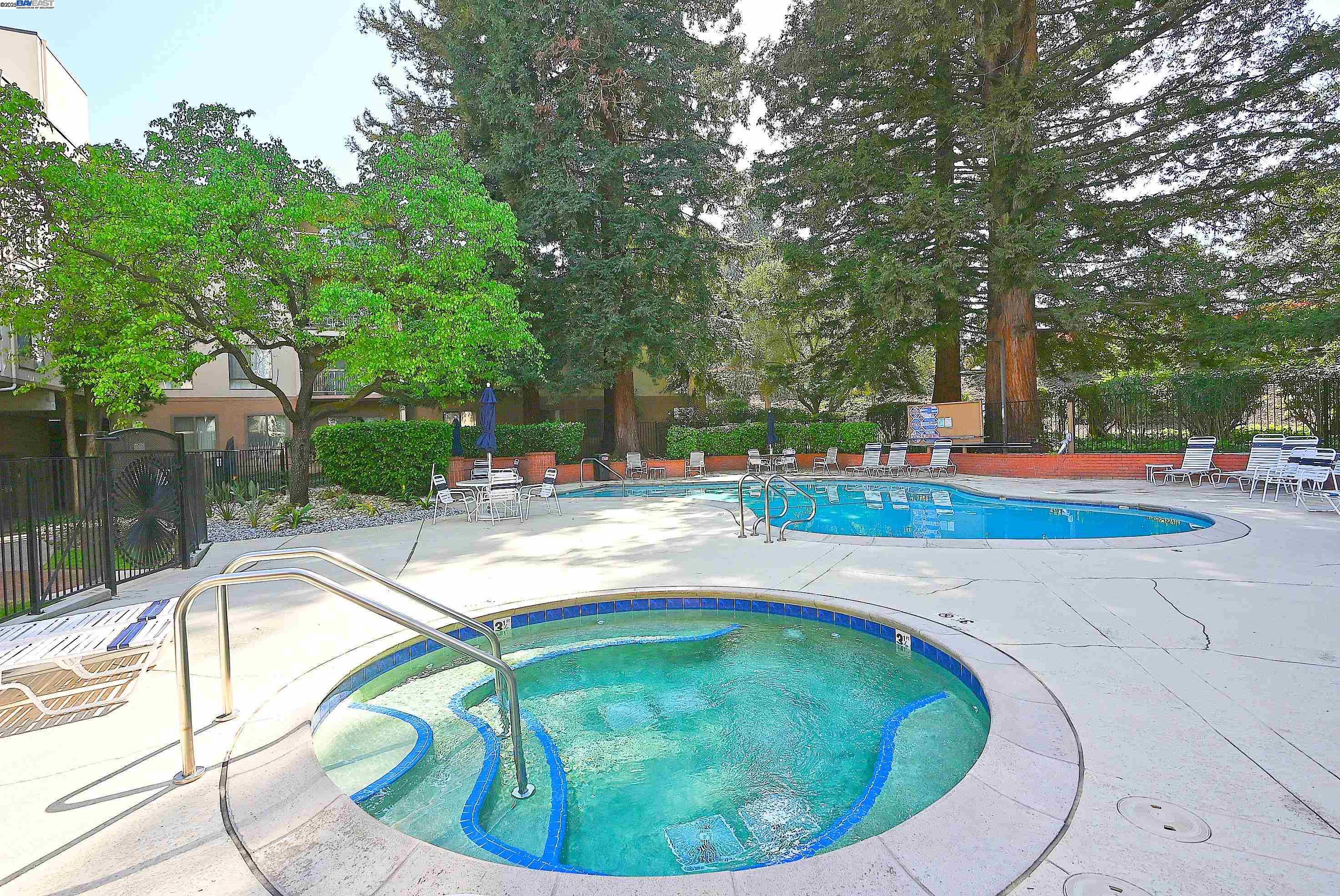 320 North Civic Drive, Unit 307 Walnut Creek, CA 94596 - Photo 28 of 37 a view of a swimming pool with an outdoor seating