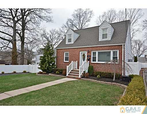110 Highfield Road Colonia, NJ 07067 - Photo 1 of 23 a front view of a house with a garden