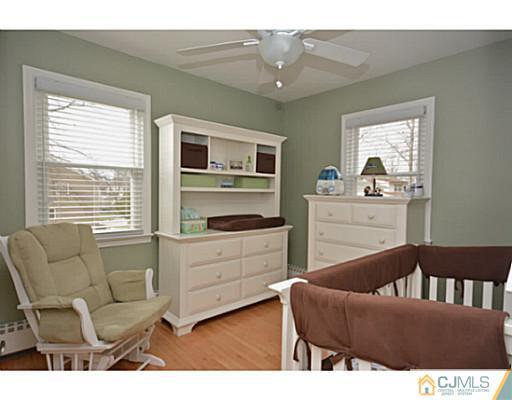 110 Highfield Road Colonia, NJ 07067 - Photo 11 of 23 a living room with furniture and a window