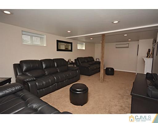 110 Highfield Road Colonia, NJ 07067 - Photo 13 of 23 a living room with furniture and a couch