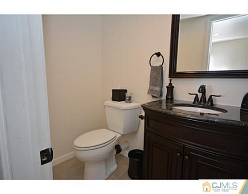 110 Highfield Road Colonia, NJ 07067 - Photo 15 of 23 a bathroom with a sink and a toilet