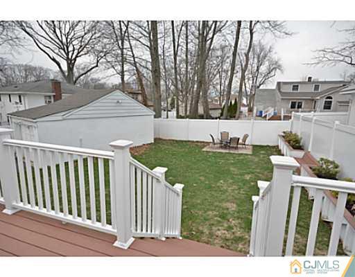110 Highfield Road Colonia, NJ 07067 - Photo 17 of 23 a view of a chair and table of the house