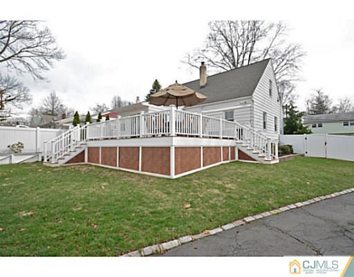 110 Highfield Road Colonia, NJ 07067 - Photo 19 of 23 a view of a house with a backyard