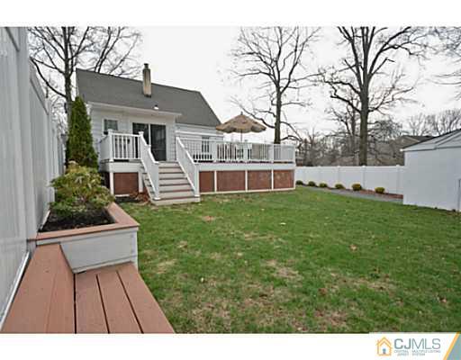110 Highfield Road Colonia, NJ 07067 - Photo 22 of 23 a front view of a house with a yard