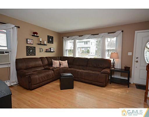 110 Highfield Road Colonia, NJ 07067 - Photo 8 of 23 a living room with furniture and a large window