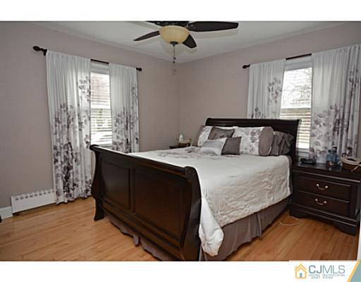 110 Highfield Road Colonia, NJ 07067 - Photo 10 of 23 a bedroom with a bed and a window