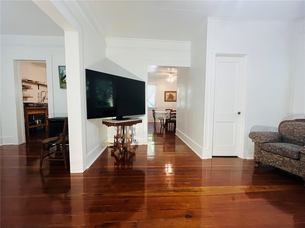 1124 Northwest 4th Street Gainesville, FL 32601 - Photo 14 of 25 a living room with furniture and a flat screen tv