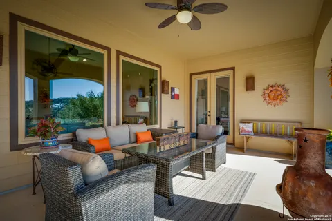a outdoor space with patio the couches and a dining table with the potted plant