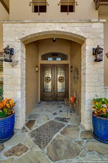 a front view of a house with outdoor seating