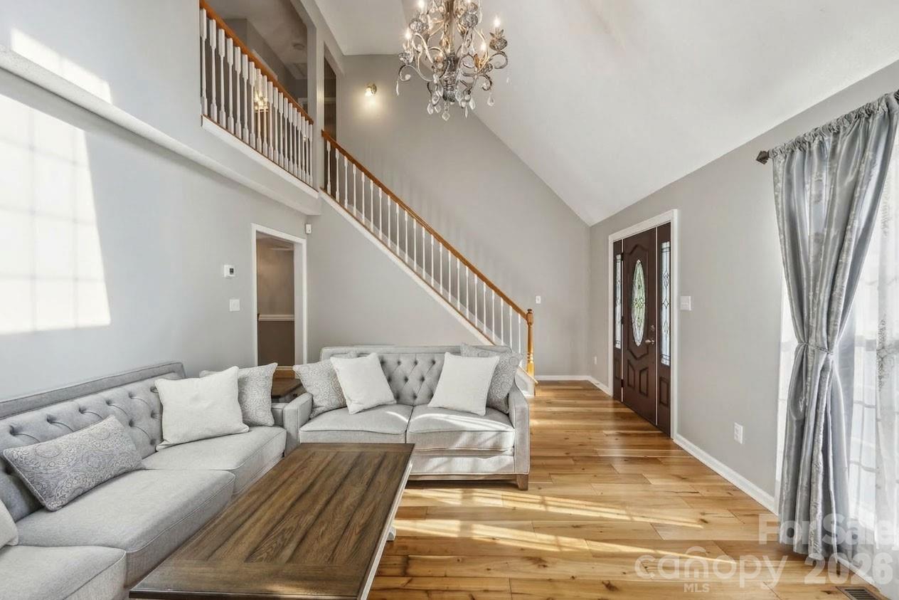 3223 Rheinwood Court Matthews, NC 28105 - Photo 3 of 16 a living room with furniture and a rug