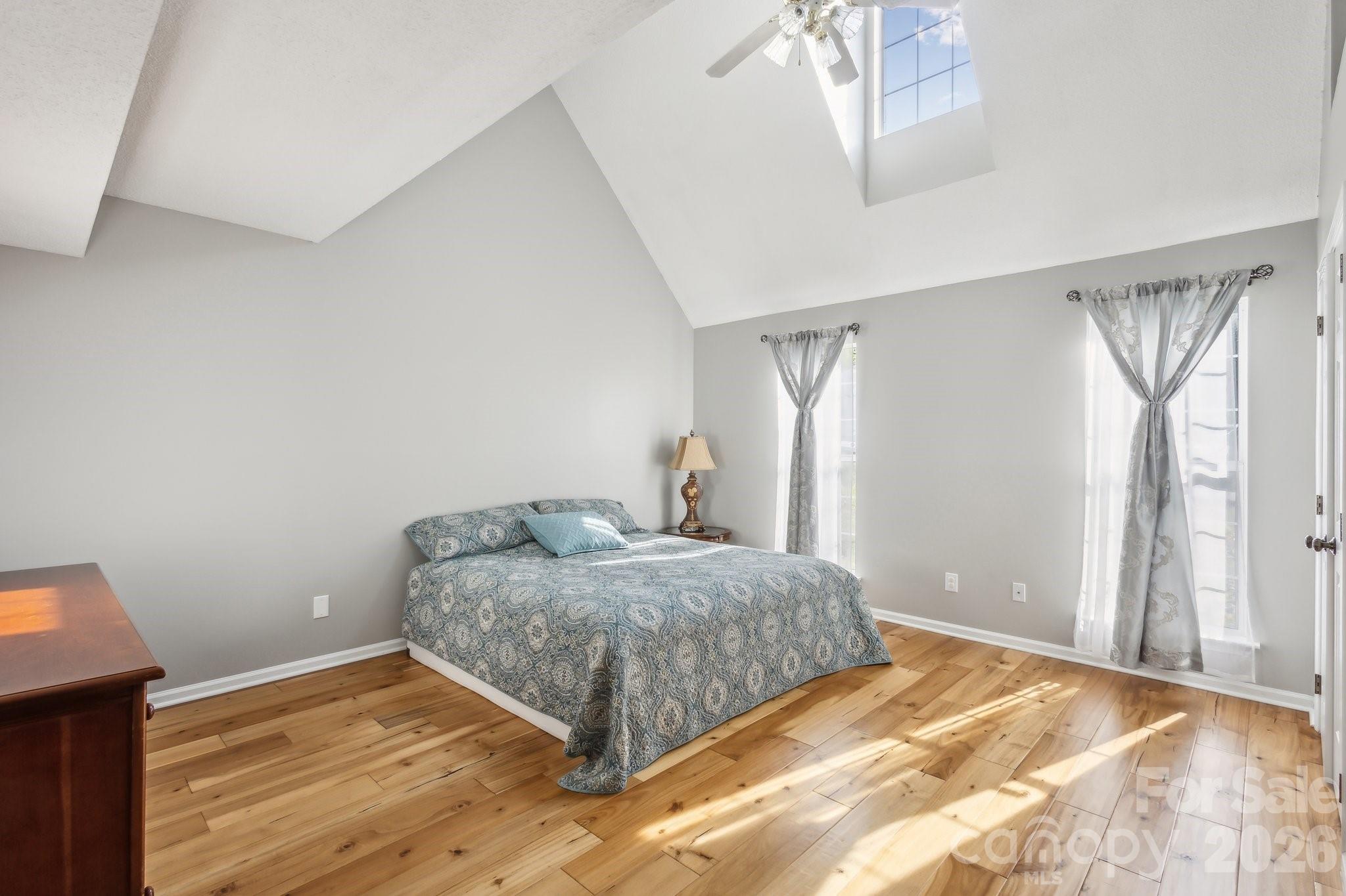 3223 Rheinwood Court Matthews, NC 28105 - Photo 4 of 16 a bedroom with a bed and a window