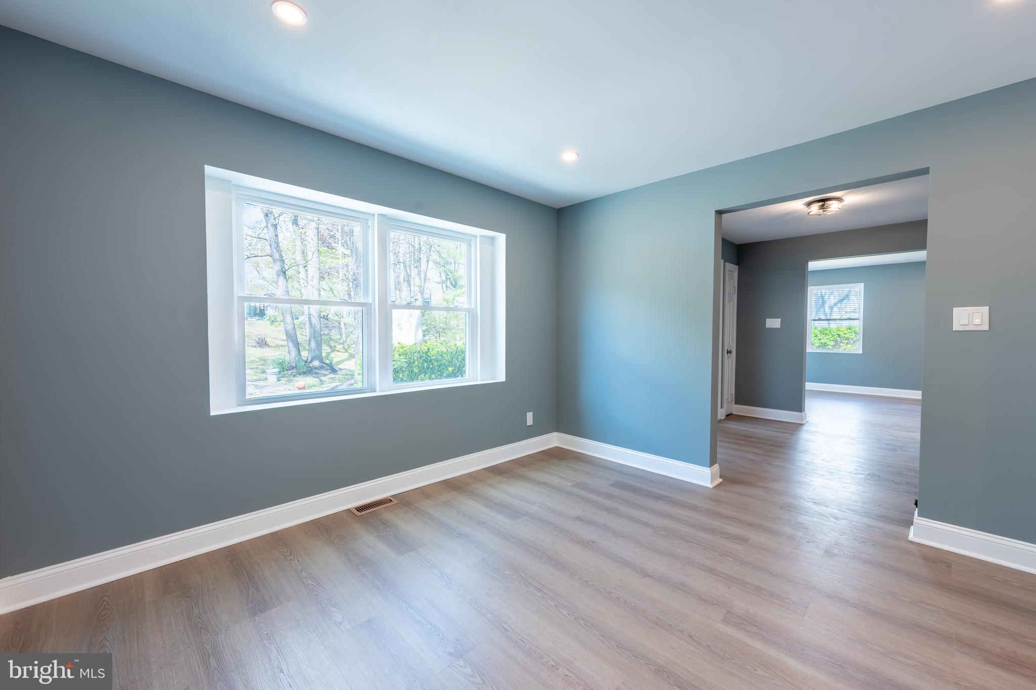 3 Slalom Court Pine Hill, NJ 08021 - Photo 12 of 47 an empty room with wooden floor and windows