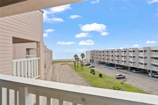 a view of swimming pool from a balcony