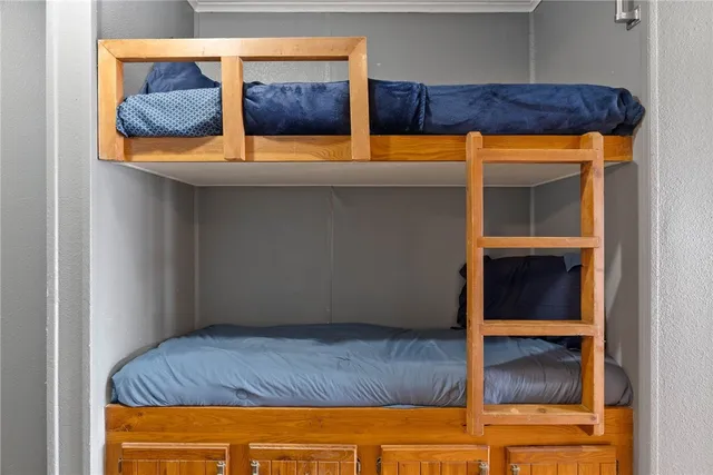 a bathroom with a sink a toilet a mirror and shower curtain