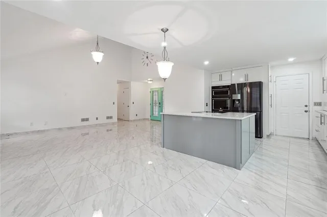 a view of a kitchen with a sink