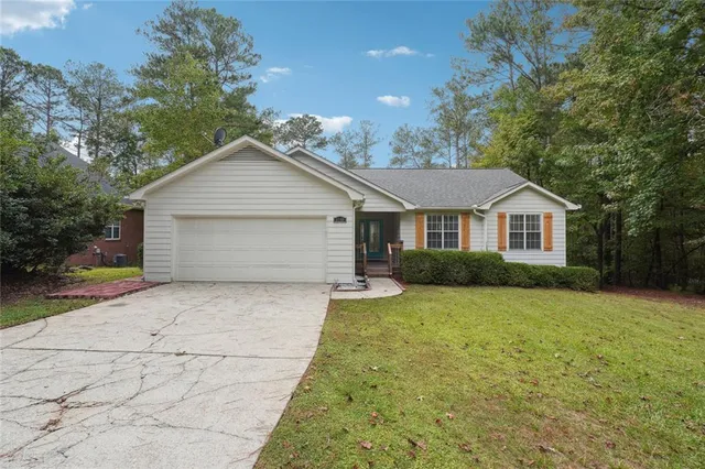 a front view of a house with yard