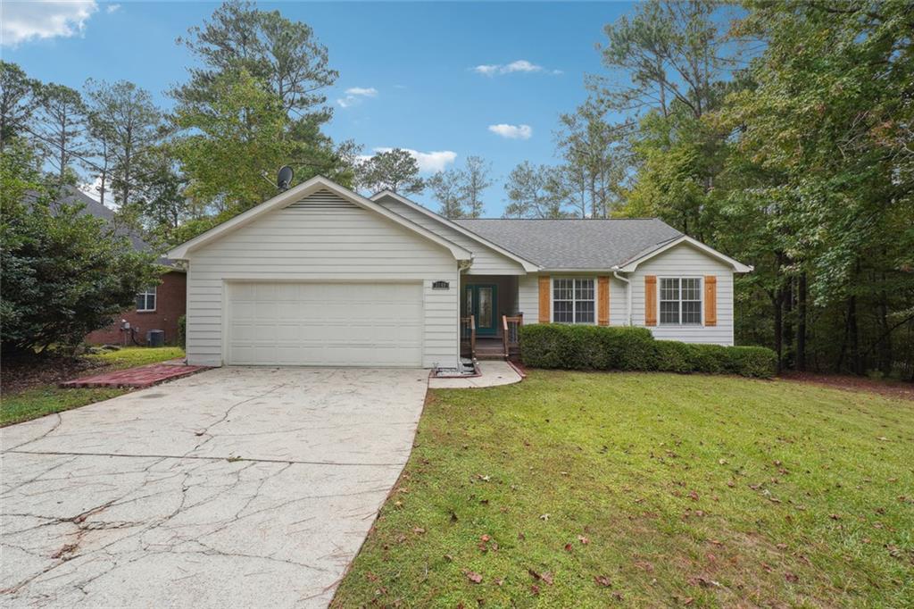 3149 Lakeview Parkway Villa Rica, GA 30180 - Photo 2 of 29 a front view of a house with yard