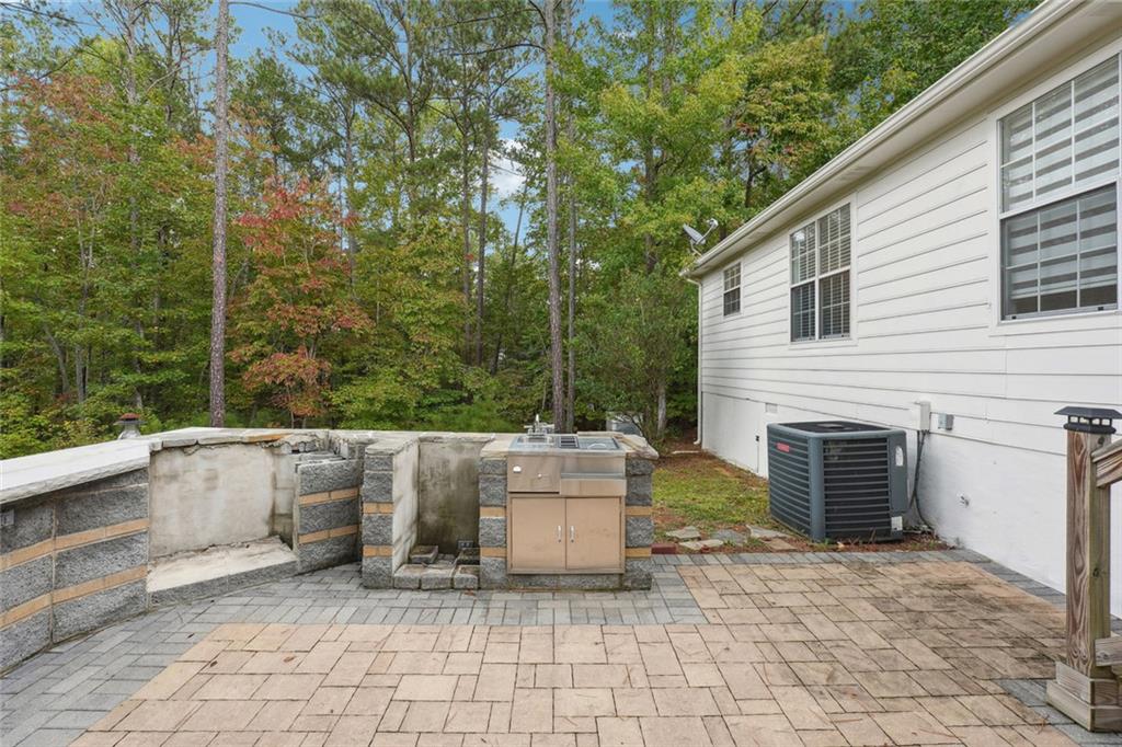 3149 Lakeview Parkway Villa Rica, GA 30180 - Photo 25 of 29 a view of a chairs and a fire pit in the back yard