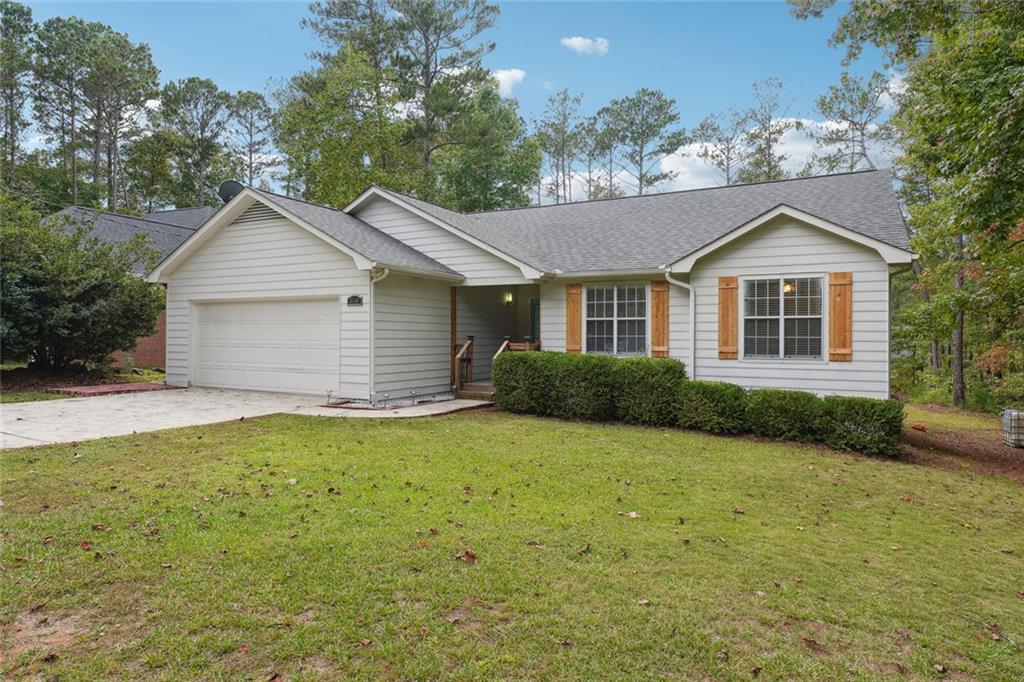 3149 Lakeview Parkway Villa Rica, GA 30180 - Photo 3 of 29 a front view of a house with a garden