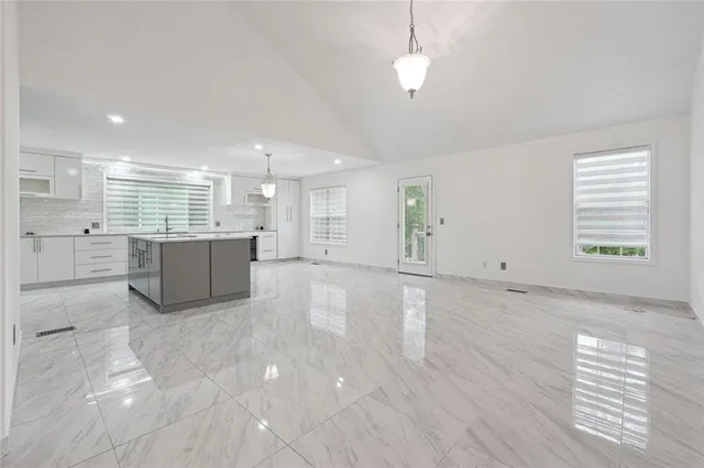 a view of a kitchen with a sink and a microwave
