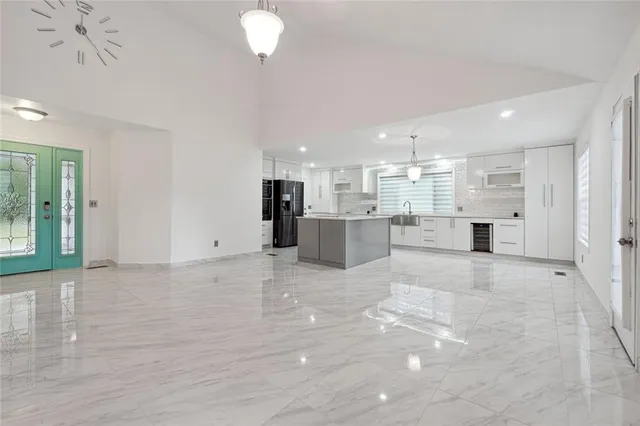 a view of a kitchen with a sink and cabinets