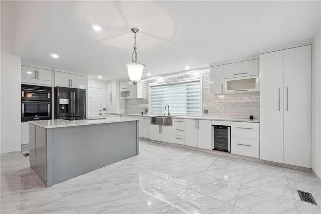 a large kitchen with cabinets