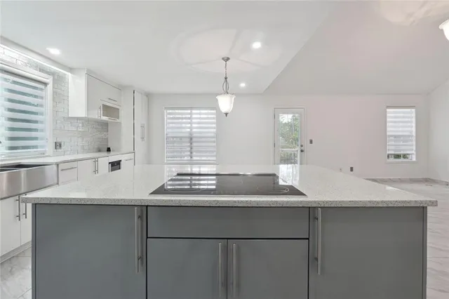 a kitchen with a sink and a window