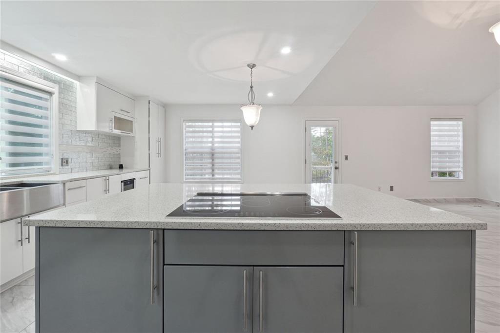 3149 Lakeview Parkway Villa Rica, GA 30180 - Photo 10 of 29 a kitchen with a sink and a window