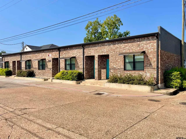 a front view of a house with a patio