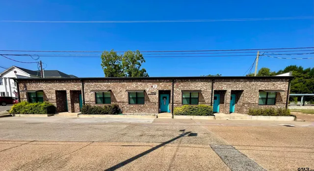 a kitchen with stainless steel appliances granite countertop a stove and a microwave
