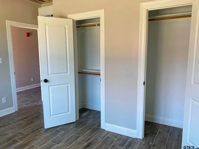 a bathroom with a granite countertop bathtub shower and vanity